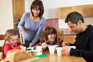 bigstock-Family-Eating-Breakfast-Togeth-38601823